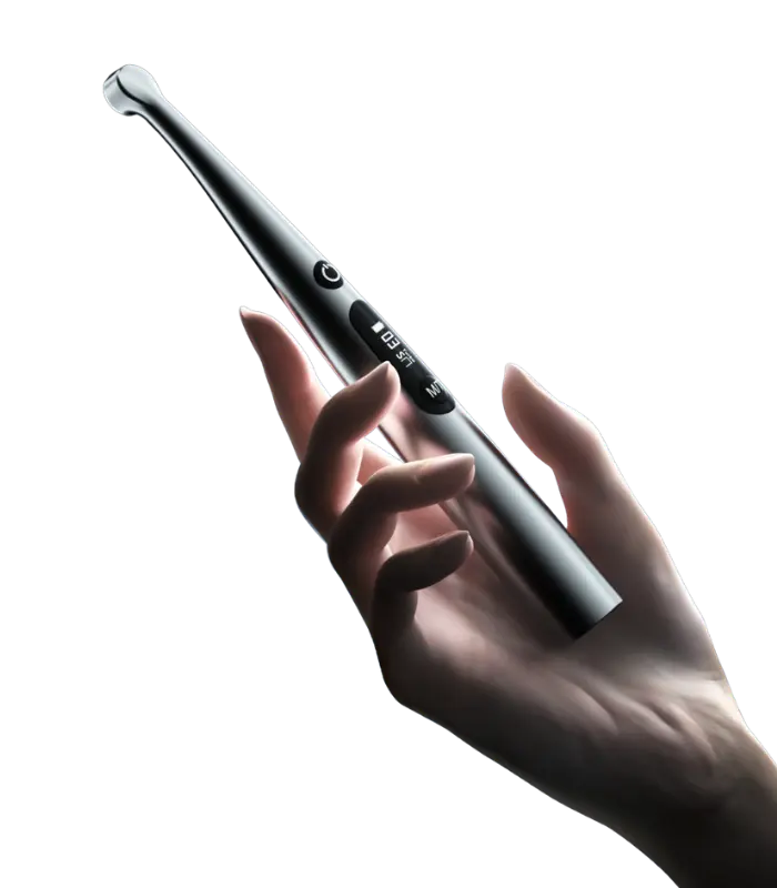Electric toothbrush held in a hand, showcasing the sleek silver handle and display buttons.